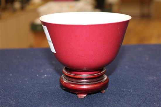A Chinese red glazed tea bowl on stand 10.5cm